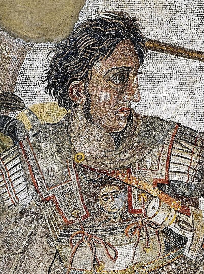 Mosaic detail of a young man on horseback in armor, wide-eyed, hair flying, rendered in tiny stone tesserae
